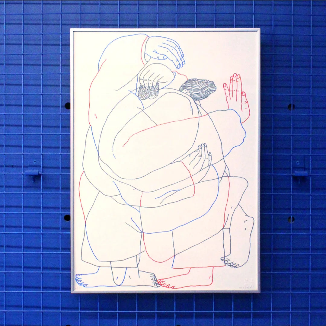 Manual screen print (50×70 cm) of an illustration of Tina Siuda showing two bodies embracing, drawn with fine linework on a white background. The figures extend almost to the edges of the paper, as if confined within its borders. The print is framed in a grey frame and hung on a Klein blue wall with matching blue metal bars.