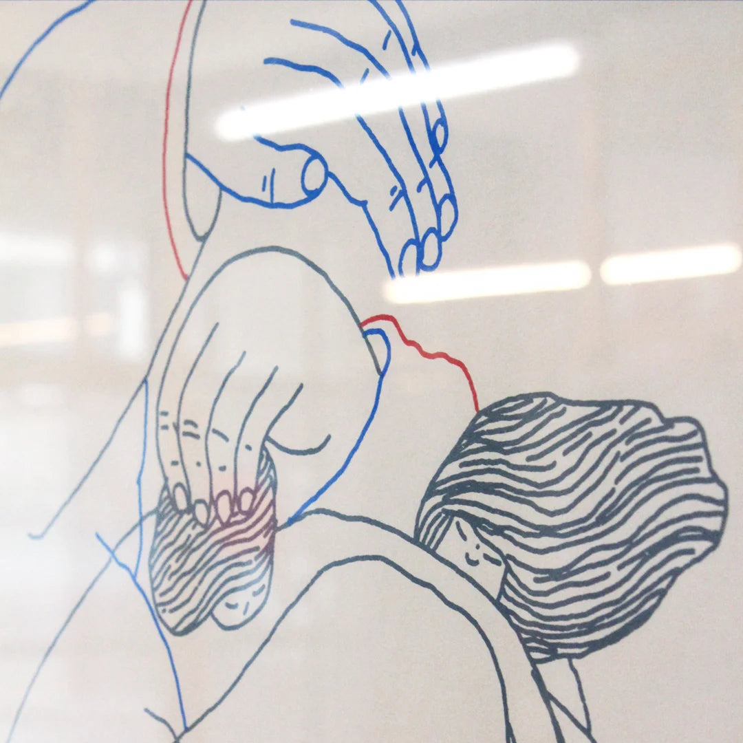 Detail of a manual screen print (50×70 cm) of an illustration of Tina Siuda showing two bodies embracing, drawn with fine linework on a white background. The figures extend almost to the edges of the paper, as if confined within its borders. The print is framed in a grey frame and hung on a Klein blue wall with matching blue metal bars.
