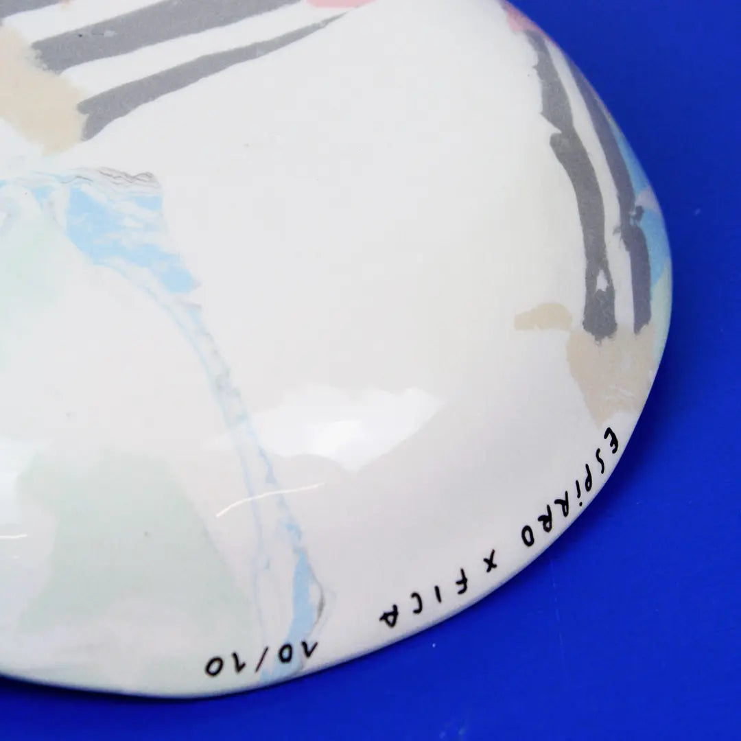 Hand-built decorative ceramic deep plate with organic, abstract forms and colourful details, made from earthenware and coloured earthenware, finished with a glossy transparent glaze. Created by artist Cíntia Coutinho, also known as Espirro.