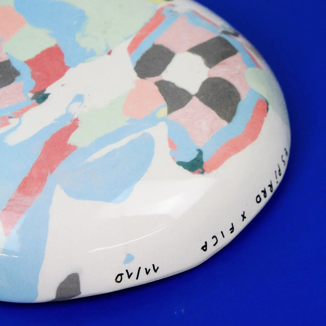 Hand-built decorative ceramic deep plate with organic, abstract forms and colourful details, made from earthenware and coloured earthenware, finished with a glossy transparent glaze. Created by artist Cíntia Coutinho, also known as Espirro.
