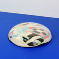 Hand-built decorative ceramic deep plate with organic, abstract forms and colourful details, made from earthenware and coloured earthenware, finished with a glossy transparent glaze. Created by artist Cíntia Coutinho, also known as Espirro.