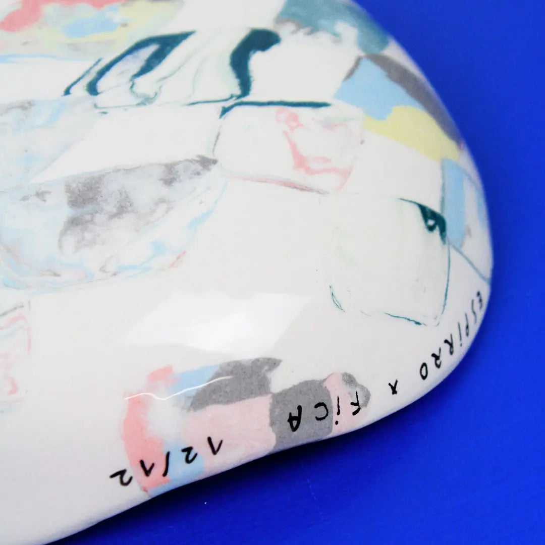 Hand-built decorative ceramic deep plate with organic, abstract forms and colourful details, made from earthenware and coloured earthenware, finished with a glossy transparent glaze. Created by artist Cíntia Coutinho, also known as Espirro.