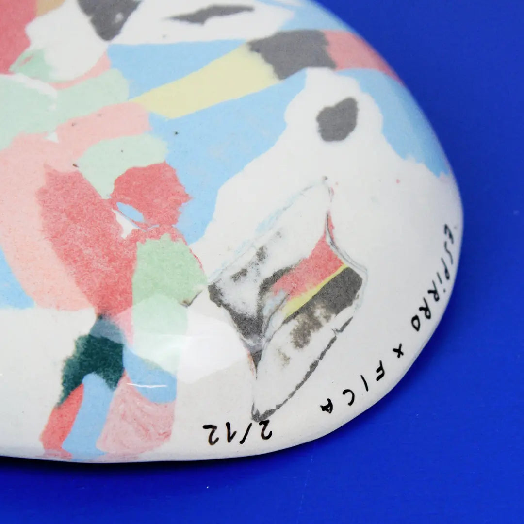 Hand-built decorative ceramic deep plate with organic, abstract forms and colourful details, made from earthenware and coloured earthenware, finished with a glossy transparent glaze. Created by artist Cíntia Coutinho, also known as Espirro.