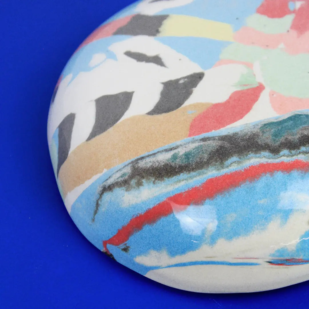 Hand-built decorative ceramic deep plate with organic, abstract forms and colourful details, made from earthenware and coloured earthenware, finished with a glossy transparent glaze. Created by artist Cíntia Coutinho, also known as Espirro.