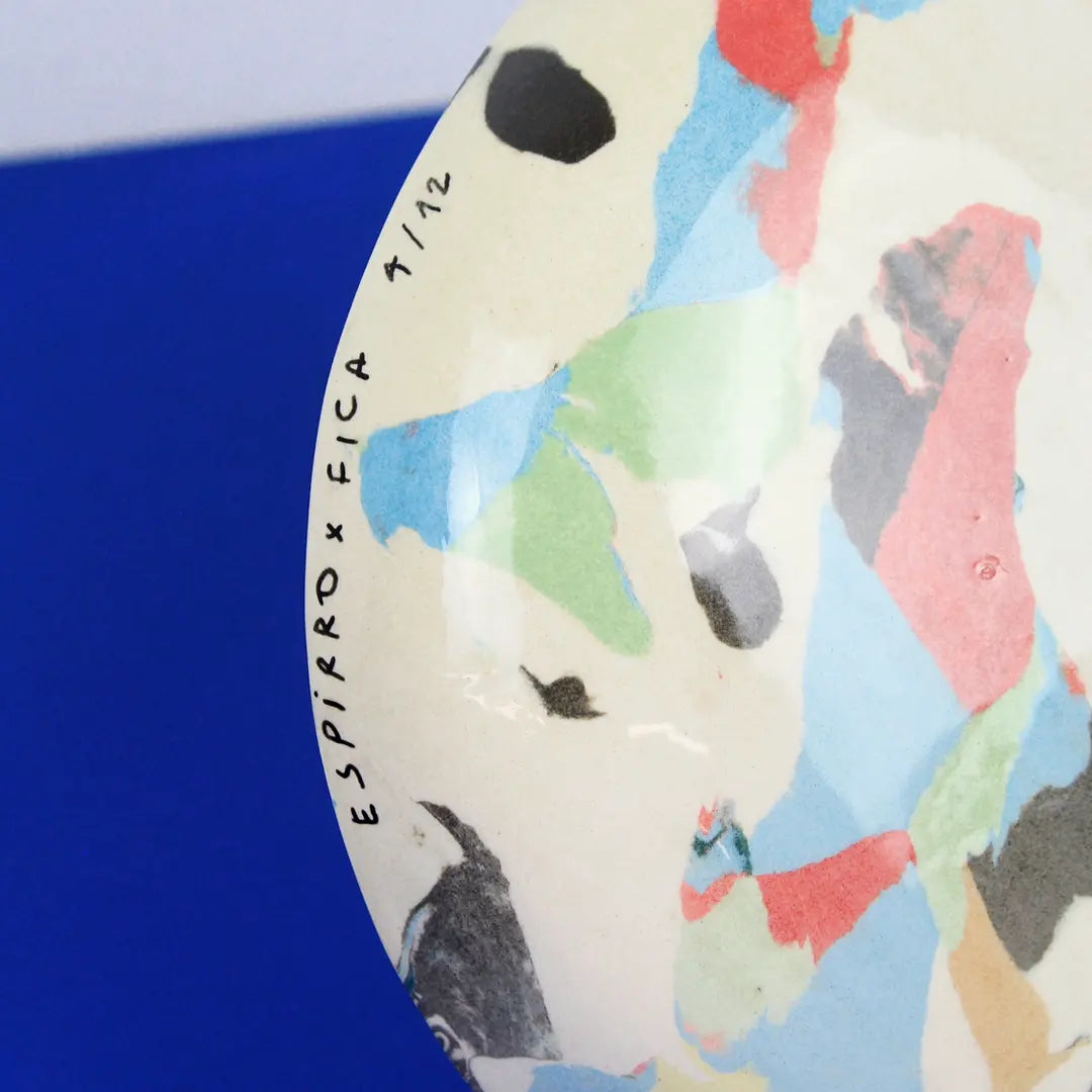 Hand-built decorative ceramic deep plate with organic, abstract forms and colourful details, made from earthenware and coloured earthenware, finished with a glossy transparent glaze. Created by artist Cíntia Coutinho, also known as Espirro.