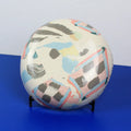 Hand-built decorative ceramic deep plate with organic, abstract forms and colourful details, made from earthenware and coloured earthenware, finished with a glossy transparent glaze. Created by artist Cíntia Coutinho, also known as Espirro.