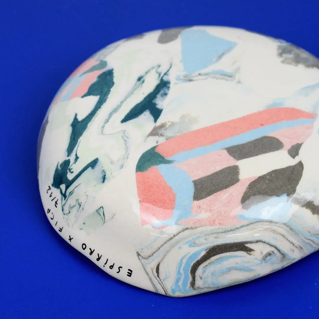 Hand-built decorative ceramic deep plate with organic, abstract forms and colourful details, made from earthenware and coloured earthenware, finished with a glossy transparent glaze. Created by artist Cíntia Coutinho, also known as Espirro.