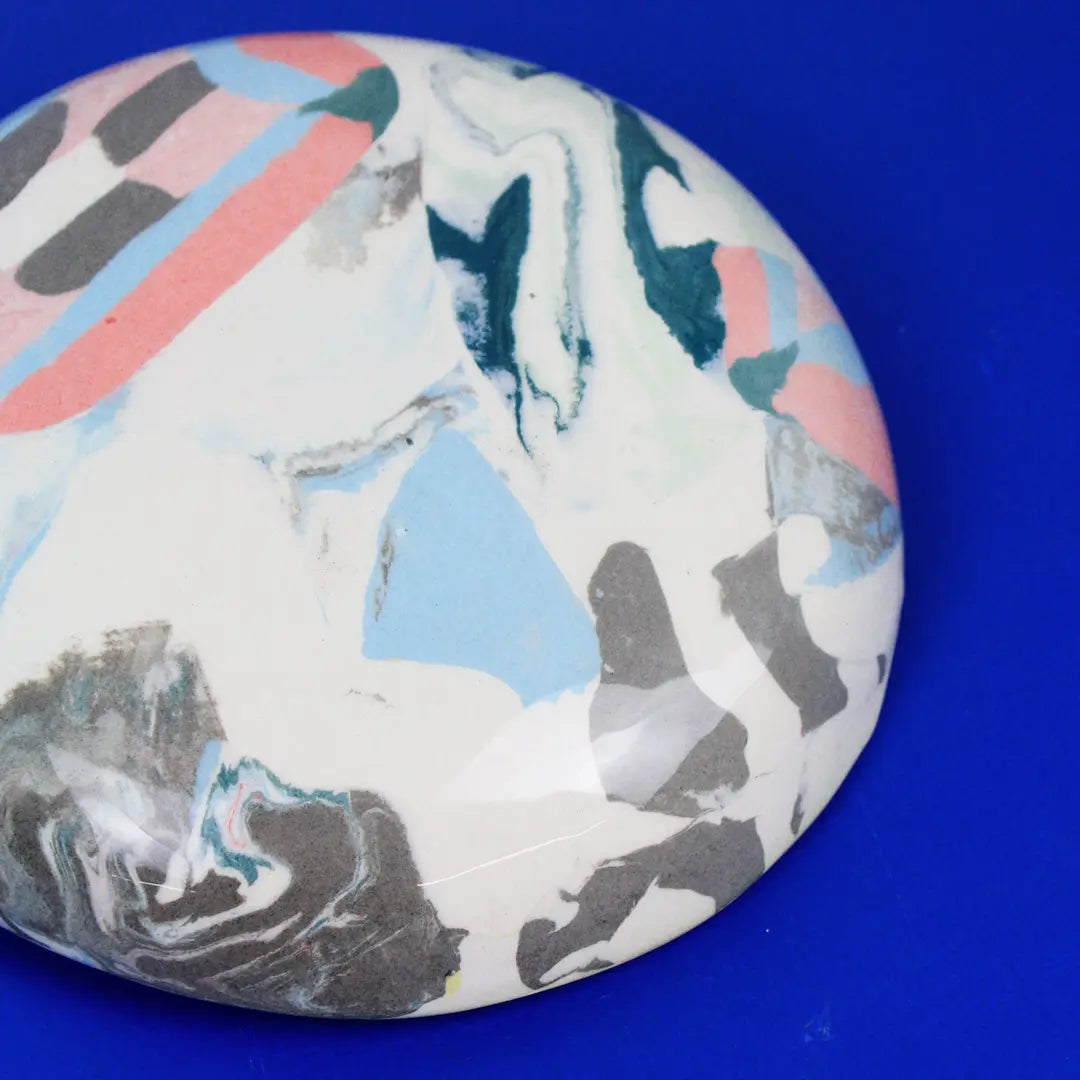 Hand-built decorative ceramic deep plate with organic, abstract forms and colourful details, made from earthenware and coloured earthenware, finished with a glossy transparent glaze. Created by artist Cíntia Coutinho, also known as Espirro.