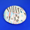 Hand-built decorative ceramic deep plate with organic, abstract forms and colourful details, made from earthenware and coloured earthenware, finished with a glossy transparent glaze. Created by artist Cíntia Coutinho, also known as Espirro.