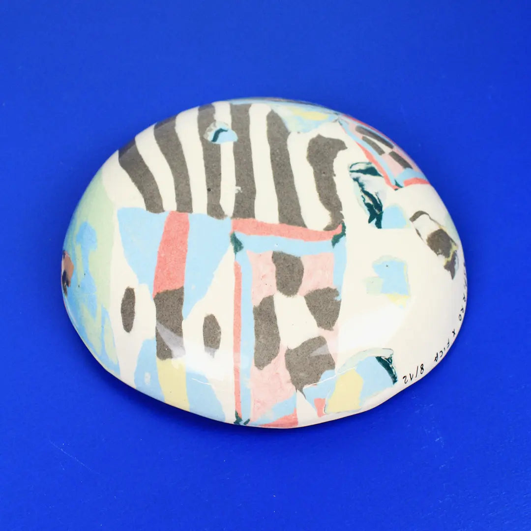 Hand-built decorative ceramic deep plate with organic, abstract forms and colourful details, made from earthenware and coloured earthenware, finished with a glossy transparent glaze. Created by artist Cíntia Coutinho, also known as Espirro.