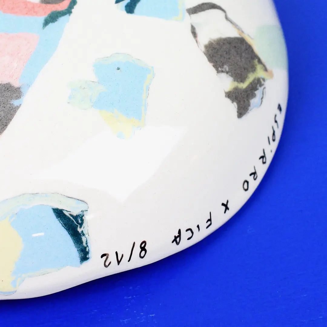 Hand-built decorative ceramic deep plate with organic, abstract forms and colourful details, made from earthenware and coloured earthenware, finished with a glossy transparent glaze. Created by artist Cíntia Coutinho, also known as Espirro.