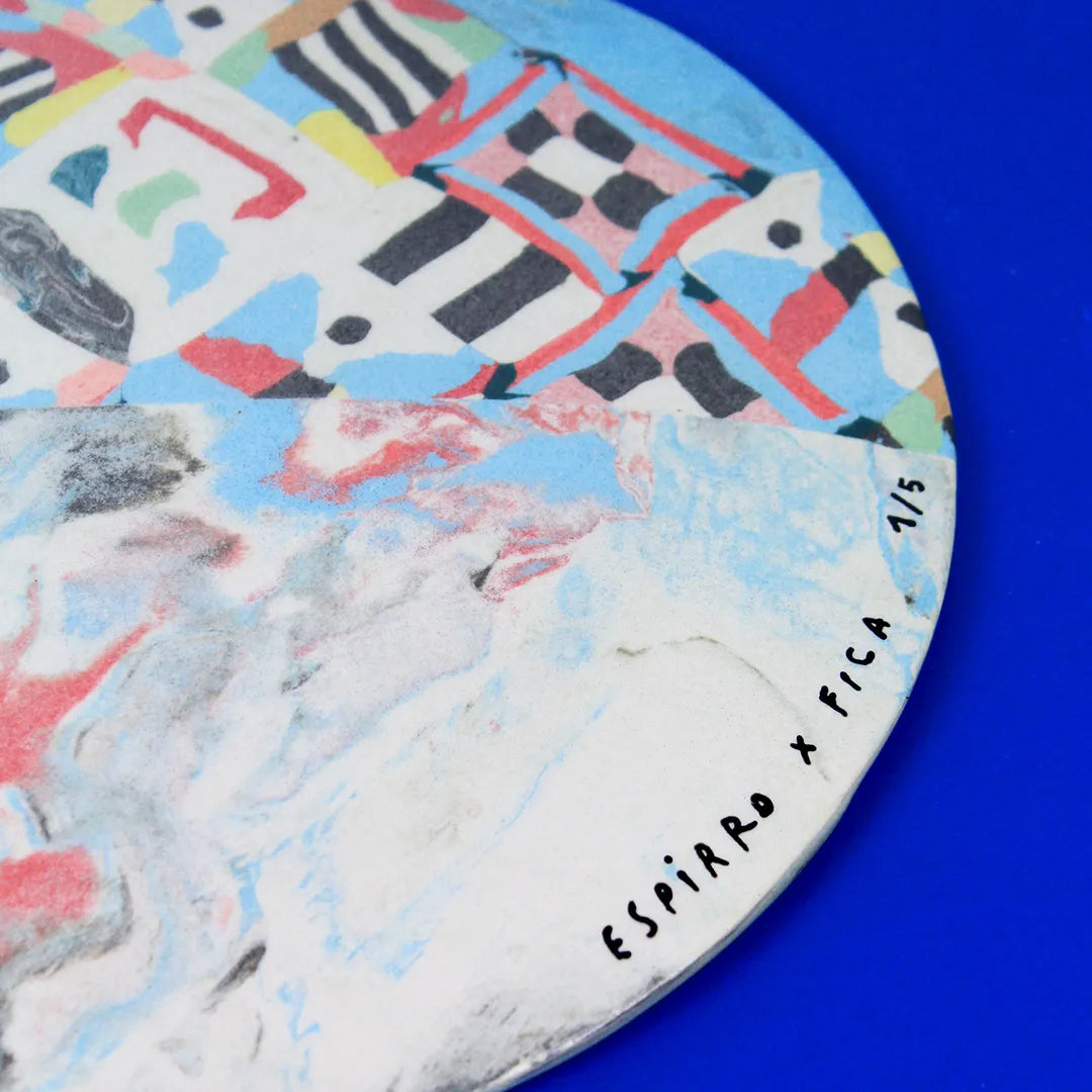 Hand-built decorative ceramic flat plate with organic, abstract forms and colourful details, made from earthenware and coloured earthenware, finished with a glossy transparent glaze. Created by artist Cíntia Coutinho, also known as Espirro.