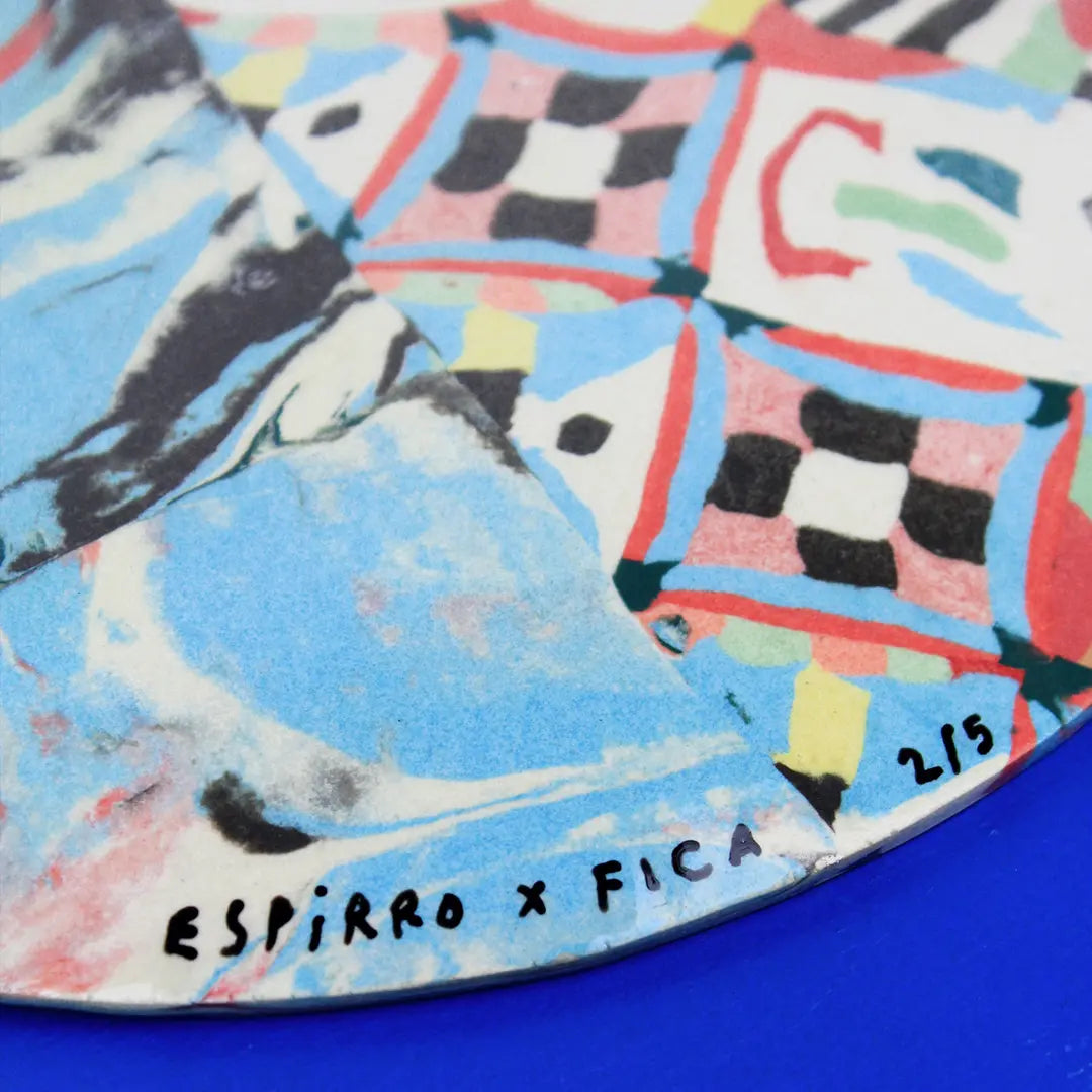 Hand-built decorative ceramic plate with organic, abstract forms and colourful details, made from earthenware and coloured earthenware, finished with a glossy transparent glaze. Created by artist Cíntia Coutinho, also known as Espirro.